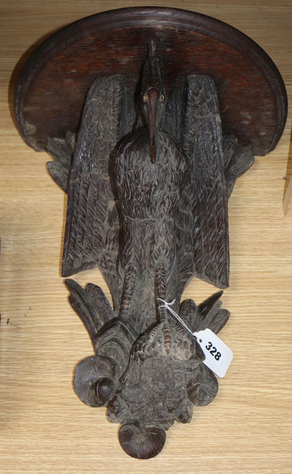 A 19th century Black Forest carved wood heron wall bracket, H.40cm